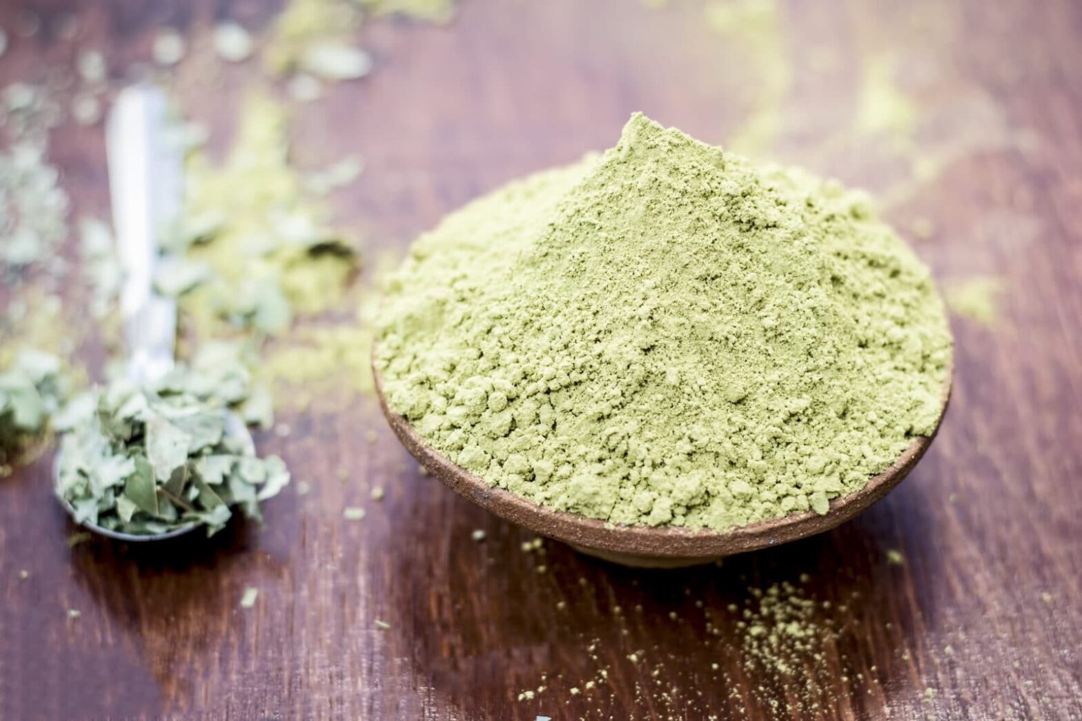 White Vietnam Kratom powder on a wooden table